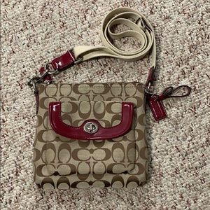 Coach crossbody purse with red accents